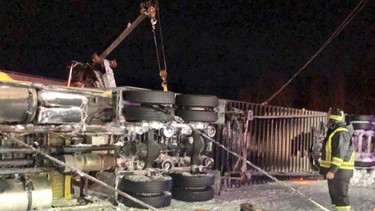 A tractor trailer carrying 30,000 pounds of diapers rolled over on Highway 401.