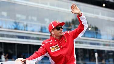 Kimi Raikkonen of Finland and Ferrari waves to the crowd on the drivers parade before the Formula One Grand Prix of Italy at Autodromo di Monza on September 2, 2018 in Monza, Italy.