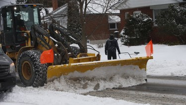 A snowplow clears the streets in East York as the first major dump of snow hit Toronto on Tuesday, Feb. 16, 2021.