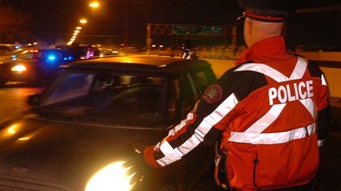 File photo: police conduct a checkstop on Macleod Trail.