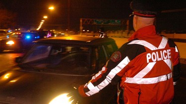 File photo: police conduct a checkstop on Macleod Trail.