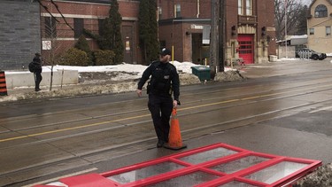 Toronto Police at the scene at Toronto Fire Station 227 at Woodbine Ave. and Queen St. E. after a woman gained access to the truck and smashed through the front door on Thursday, February 10, 2022.