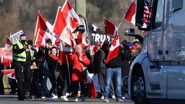 Anti-vaccine mandate protesters demonstrate on Highway 15 near the Pacific Highway Border Crossing on the US-Canada border with Washington State in Surrey, British Columbia, Canada on February 12, 2022.