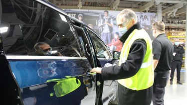 Stellantis CEO Carlos Tavares checks out a vehicle at the Windsor Assembly Plant on Wednesday, Feb. 9, 2022.