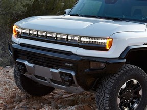 Unique lighting elements highlight the GMC Hummer EV’s front grille