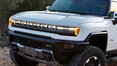 Unique lighting elements highlight the GMC Hummer EV’s front grille