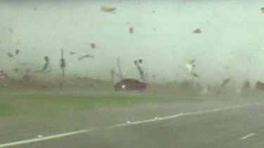 Video footage captures an early-2000s Chevrolet Silverado driving through a tornado in Texas.