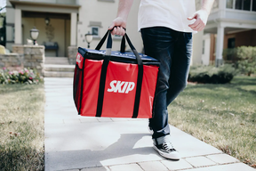A Skip the Dishes delivery driver drops off food