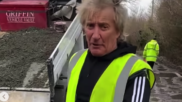 ‘My Ferrari can’t go through’: Rod Stewart and "mates" fill potholes on the road to his house