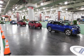 A row of electric vehicles await test drivers at the EV Test Track in the basement of the Javits Convention Centre.