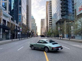 The vintage Porsche 911 EV on a closed off Georgia Street the morning of the Vancouver Sun Run involving 23,000 participants.