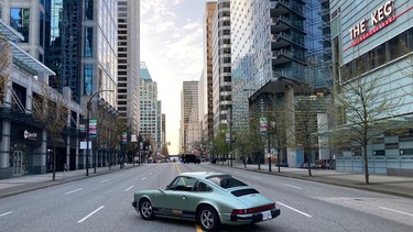The vintage Porsche 911 EV on a closed off Georgia Street the morning of the Vancouver Sun Run involving 23,000 participants.