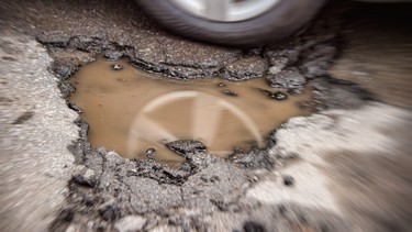 Large pothole in Montreal, Quebec.