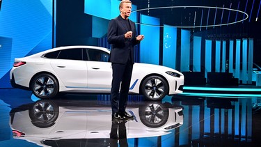 Oliver Zipse, CEO of German car maker BMW, stands in front of a BMW i4 electric car during a press presentation at the International Motor Show (IAA), on September 6, 2021 in Munich, southern Germany.