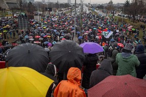 People gather to block the highway, in Belgrade, on December 11, 2021 to protest against the Anglo-Australian company Rio Tinto’s plan to open a lithium mine in the country.