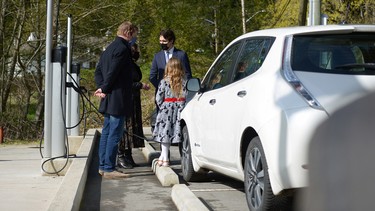 A car sits parked at a charging station as Canadian Prime Minister Justin Trudeau speaks to media, highlighting his government's new budget with a visit to Royal Roads University in Victoria, British Columbia, Canada April 11, 2022.