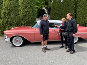 Ian Tanner hands over the keys after finding and restoring his parents Ray and Virginia Tanner’s prized pink Cadillac.
