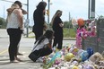 A group of women grieve at the crash scene memorial paying tribute for Karolina Ciasullo and her family Karla, 6; Lilianna, 3; and Mila, 1, who were killed  in a horrific crash  at Torbram Rd. and Countryside Dr. in Brampton, Ontario.
