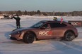 A Porsche Taycan about to set a record for most consecutive donuts on ice