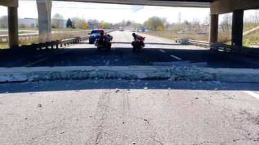 OPP posted a video on Twitter of part of the Highway 403 overpass at the Wayne Gretzky Parkway that fell to the road below.