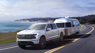 2022 Ford F-150 Lightning Lariat towing a trailer