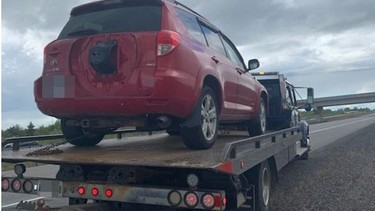 A vehicle is towed from the side of Highway 69 on May 22 after the driver was clocked going 160 km/hr in a 100 km/hr zone. OPP photo