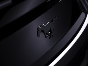 A picture of a black Ford Mustang badge