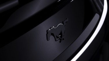 A picture of a black Ford Mustang badge