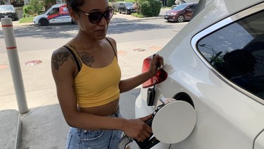 Mary Benjamin fuels up Wednesday in the Upper Beach when prices were below $2 a litre.