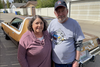 Heather and Dave Eamon with their freshly restored 1975 Plymouth Road Runner, completed with plenty of help from members of the Northern Mopars Auto Club. CREDIT: Dave Eamon