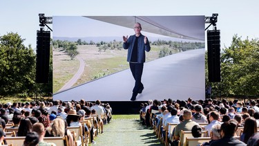 Apple CEO Tim Cook is displayed on a screen while speaking during Apple's annual Worldwide Developers Conference in San Jose, California, U.S. June 6, 2022.