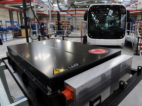 Lithium batteries of the BlueBus (background), a 2-meters-long electric bus dedicated to public transport, are pictured at the Bollore Group plant, in Ergue-Gaberic, western France, on January 15, 2016.