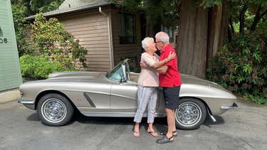 A birthday kiss from Linda Davidson who gave husband John his 1962 Corvette dream car on his 75th birthday.