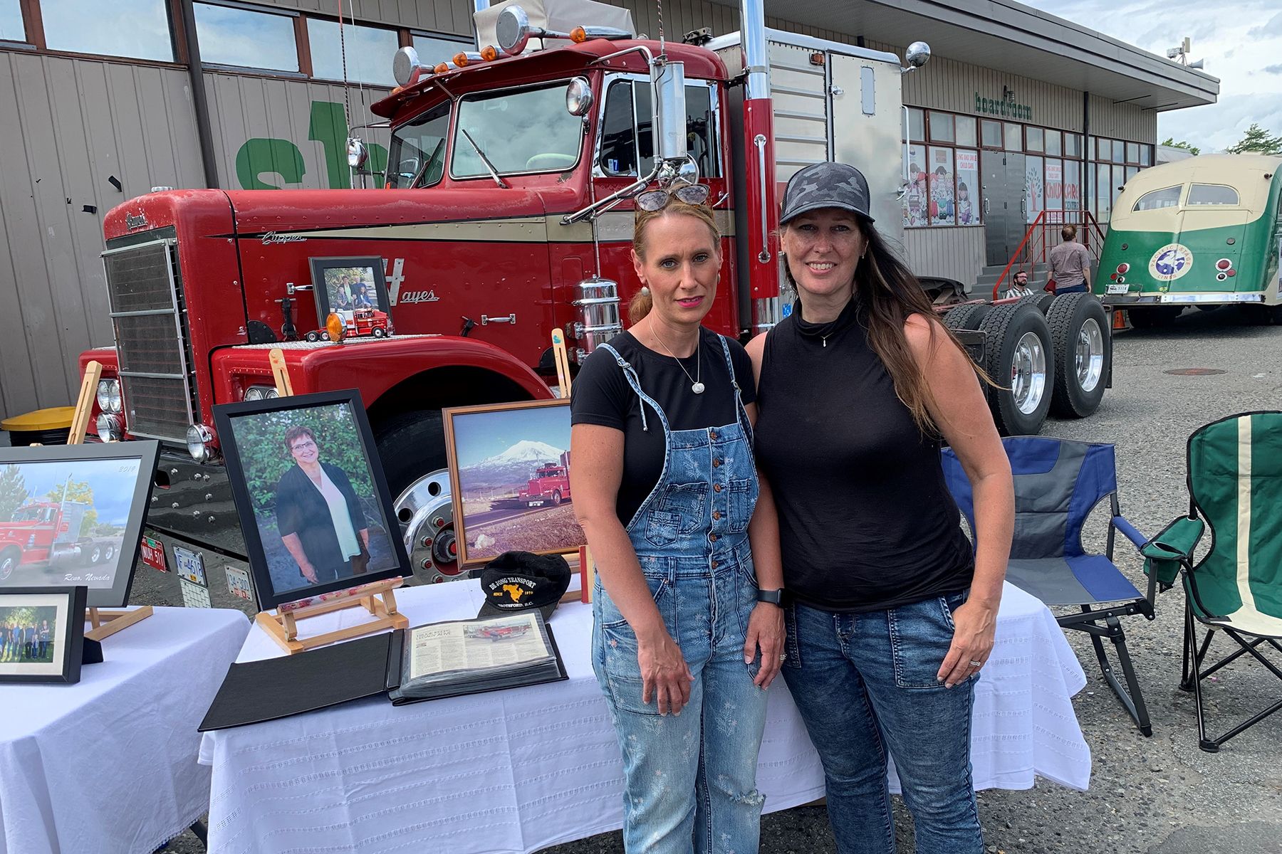 Kimberley Coleman and Sandra Barthel with the 1966 Hayes Clipper their late father Arnie DeJong drove as a new truck. CREDIT: Alyn Edwards