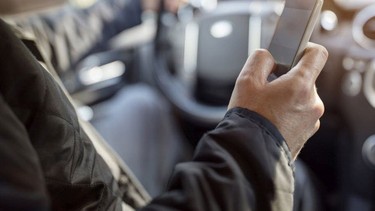 Are you allowed to plug in your telephone whereas driving in Quebec?