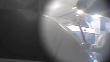Hidden camera footage of an auto body shop employee deliberately damaging the vehicle by striking the car’s open hood on the passenger’s side.