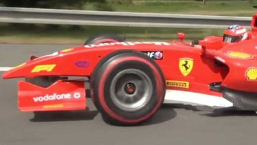 A screenshot from a video of a Ferrari F1 tribute car spotted on a Czech highway
