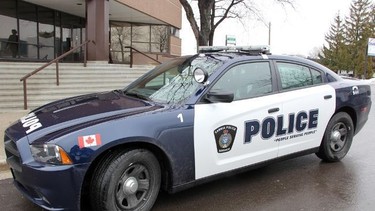 A Sarnia police cruisier is parked in front of the police station.