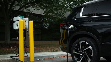 Outlander PHEV plugged into a charging station