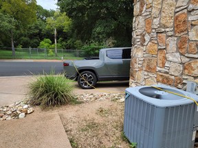 A Rivian R1T plugged into the tools in a doctor's office in Texas