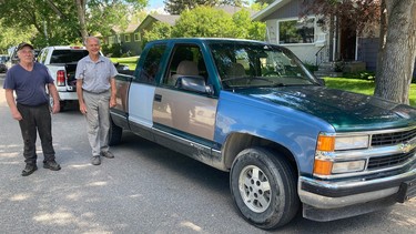 Neigbhours Clark Shanks (left) and Mark Soehner with the 1995 Chevy Silverado. Soehner drove the truck close to 360,000 km before he parked it in 2017, and then sold it in 2021 to Shanks, who tended to the mechanical systems and is now repairing the body.