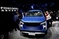 People take photos of Foxconn's new electric pickup vehicle, the Model V, during the company's annual Tech Day in Taipei, Taiwan, October 18, 2022