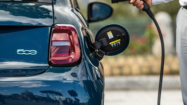 The European-spec Fiat 500e with an EV charging cable, about to be charged