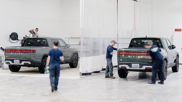 Rivian technicians prepare R1 vehicles for delivery in the just-opened service centre in Richmond, B.C.
