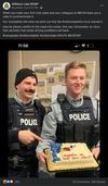 Williams Lake RCMP constables holding a cake sent to congratulate them on a viral video