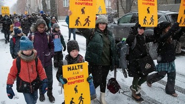 Youngsters walk from Parc des Royaux to their school on Friday, December 16, 2022 to honour seven-year-old Maria Legenkovska, who was killed nearby by a hit-and-run driver.