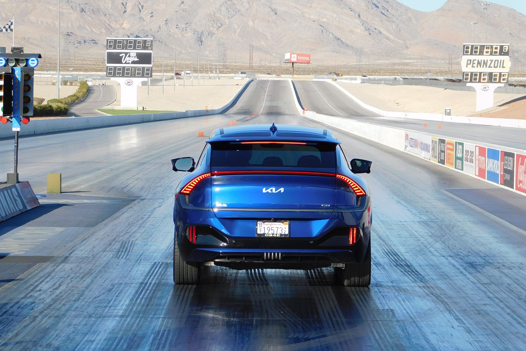 A 2023 Kia EV6 GT stages at the Las Vegas Motor Speedway drag strip for a quarter-mile pass. CREDIT: Andrew McCredie