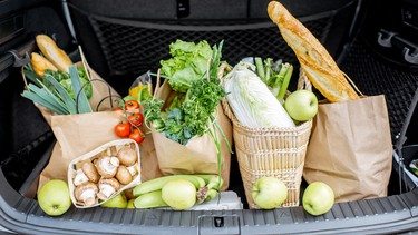 Car trunk loaded with produce.