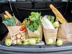 Car trunk loaded with produce.