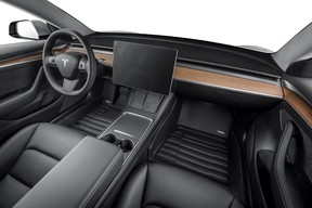 A Tuxmat carpet cover floormat in a Tesla